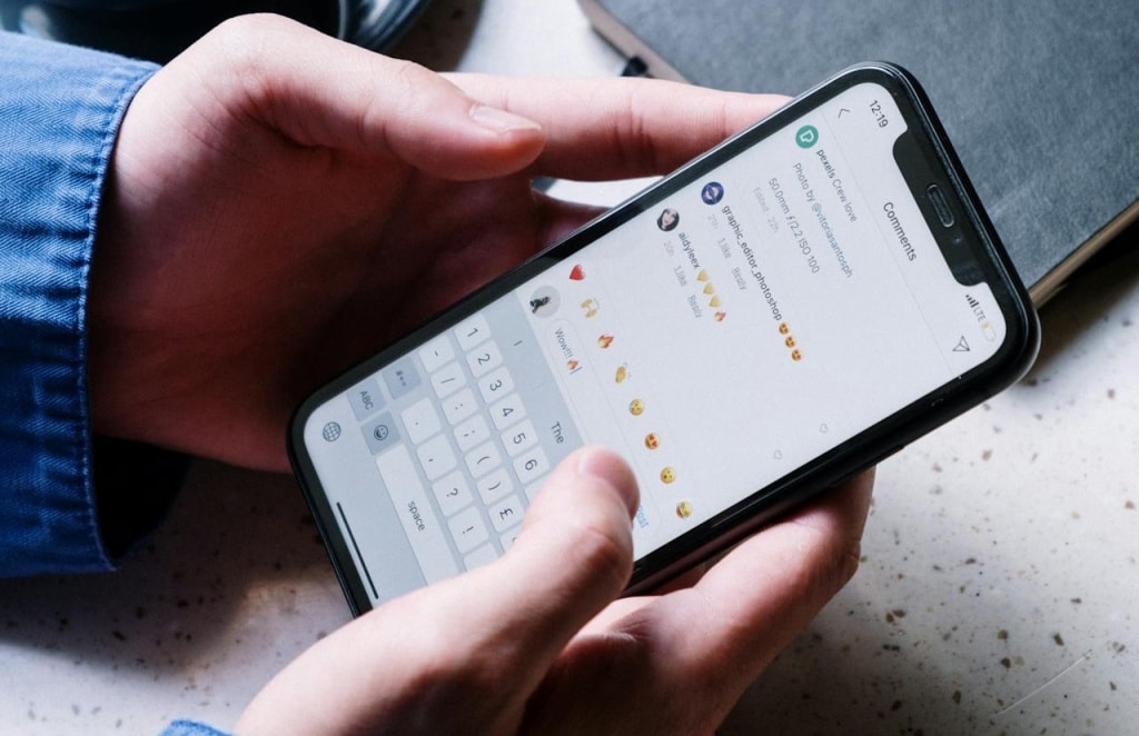 Someone typing a comment on an Instagram post