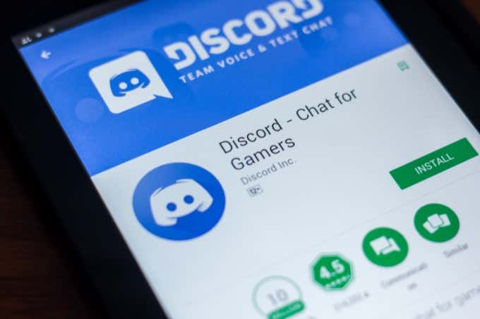 How to Mute Someone on Discord image - Ryazan, Russia - March 21, 2018 - Discord mobile app on the display of tablet PC.