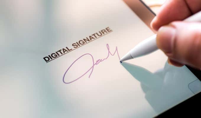 someone signing a document - e-signature