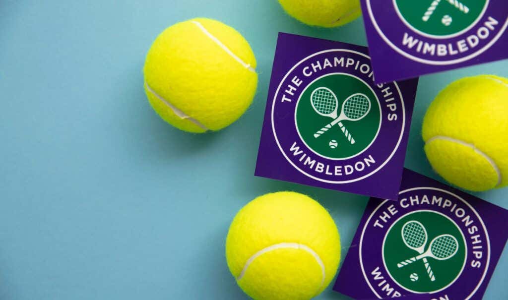 How to Watch Wimbledon 2023 Online without Cable image - LONDON, UK - June 2022: Wimbledon tennis championships logo with tennis ball