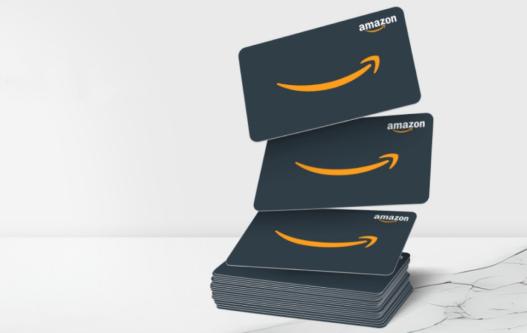 A Stack of multiple Amazon gift cards on a marble surface 